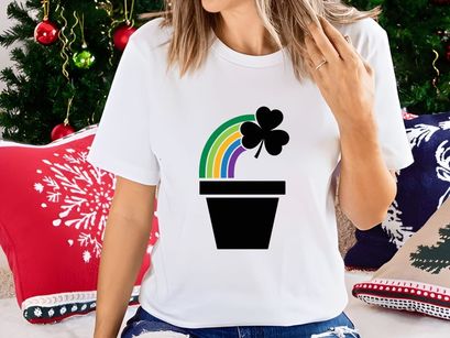 Colorful rainbow arching over black heart in pot minimal design