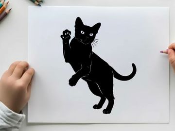 Black cat silhouette with paw raised in a playful pose silhouette preview picture
