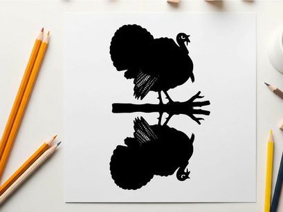 Silhouette of a turkey on a tree branch at night