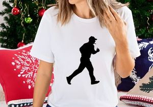 A silhouette of a man jogging or running in a casual outfit and cap
