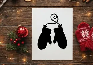 Silhouette of Christmas mittens hanging on a string for holiday decor