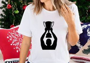 A person holding up a trophy in triumph and celebration