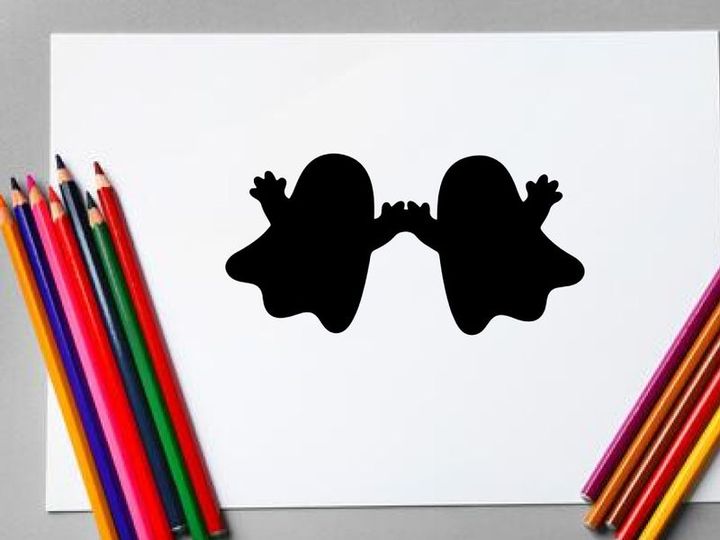 Silhouette of two children holding hands, playful and joyful scene