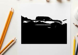 Silhouette of a pickup truck against a mountain range silhouette