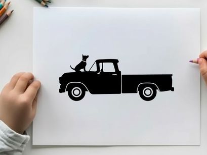Silhouette of a cat sitting in a vintage pickup truck