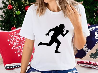 A black silhouette of a person running with a football helmet on their head
