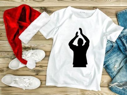 A silhouette of a person with their hands raised above their head in a gesture