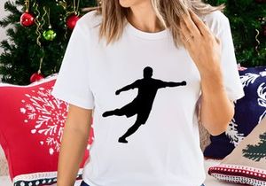 A black silhouette of a person kicking with dynamic movement and energy