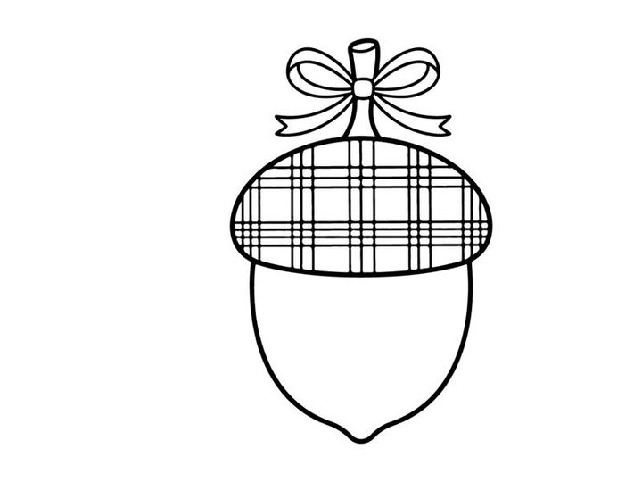Cute Christmas ornament hanging on a string. Festive holiday decoration with a plaid pattern and bow, ideal for seasonal marketing and greeting cards.