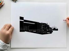 Silhouette of a semi truck at a warehouse loading dock