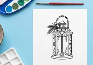 Elegant white Christmas lantern with ornate design and festive pinecone decoration for holiday decor