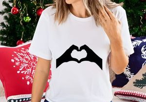 Hands forming heart shape love gesture minimal black silhouette