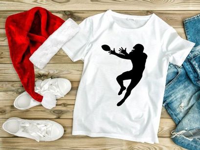 American football player catching a ball in mid air silhouette