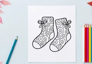 Pair of festive Christmas socks with snowflake and bow designs for holiday celebrations