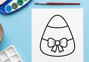 Candy corn icon with a bow. Minimalist Halloween candy vector illustration.