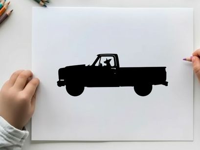 Silhouette of a pickup truck with a dog sticking out the window