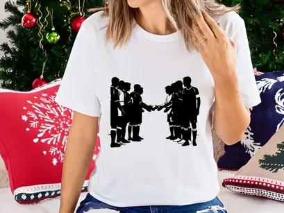 Silhouette of two soccer teams shaking hands after a match