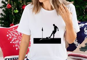 Silhouette of a soccer player kicking a ball near a corner flag on a field