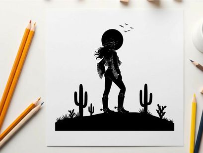 Silhouette of a cowboy standing on a desert hill