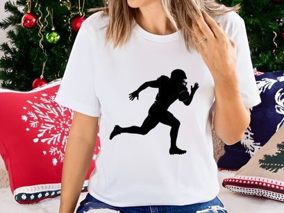 American football player running with ball in hand silhouette