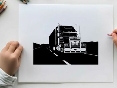 Silhouette of a semi truck driving on a highway at night