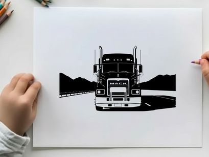 Mack truck silhouette on a deserted highway at dusk