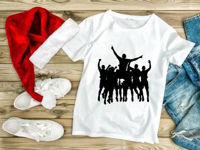 A group of people jumping in the air with their arms raised in celebration and joy together