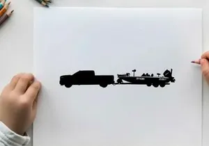 Silhouette of a pickup truck towing a fishing boat