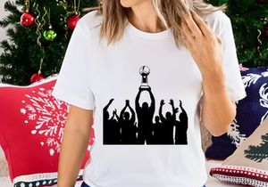 Silhouette of a group celebrating with a trophy