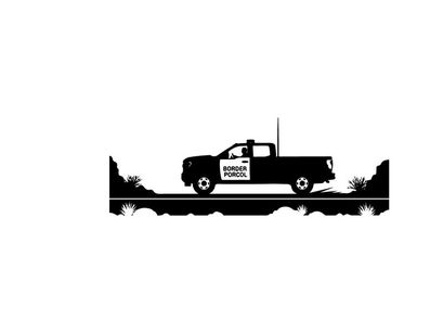 Silhouette of a pickup truck driving on a road with trees