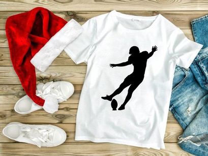 American football player kicking a ball in mid air motion silhouette