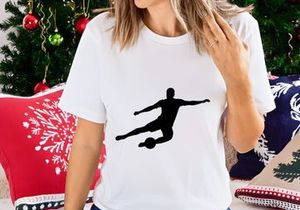 Soccer player kicking a ball in mid air motion silhouette