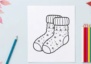 Hand-drawn white knitted Christmas stocking with snowflake patterns and cuff detail
