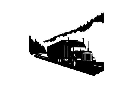 Semi truck driving on a winding road through a forest in silhouette
