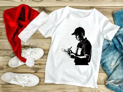 A man in a cap writing on a clipboard with a pen