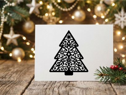 Black ornate Christmas tree silhouette with intricate filigree pattern on white background