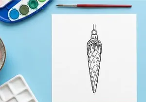 Silver Christmas dove ornament with geometric pattern hanging on tree for festive holiday decor