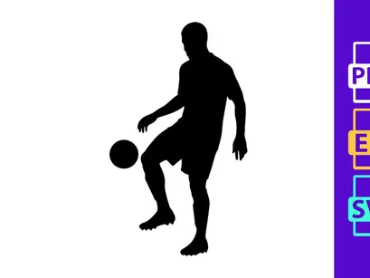 Silhouette of a soccer player kicking a ball in mid action