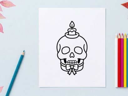 Halloween skull candle holder with lit flame. Spooky decorative ceramic skull for festive home decor and party centerpiece.