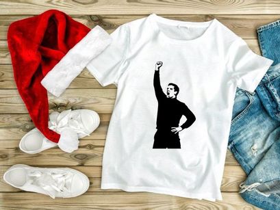 A man with his fist raised in a gesture of triumph or defiance