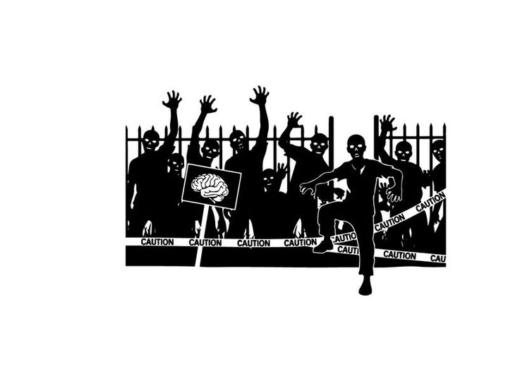 Silhouette of a man standing in front of a group of raised silhouettes behind a fence silhouette