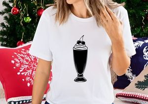 Chocolate ice cream sundae with whipped cream and cherries in tall glass