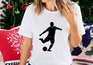 Soccer player kicking a ball in motion
