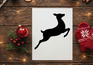 Silhouette of a jumping dog in motion on white background