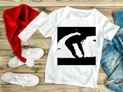 Man bending down in a field at sunset with a serene and peaceful atmosphere