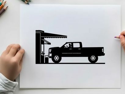 Silhouette of a pickup truck refueling at a gas station