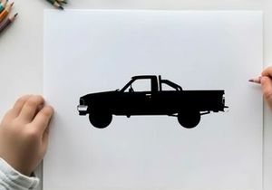 Silhouette of a classic pickup truck against a white background