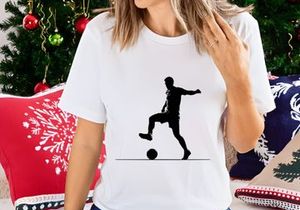 A soccer player kicking a ball in a dynamic pose on the field