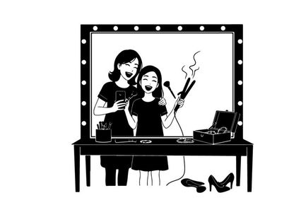 Silhouette of two girls singing with microphones in front mirror