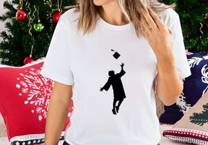 Graduate throwing cap in air, silhouette, graduation celebration